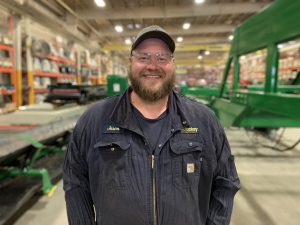 image of man standing at this workplace