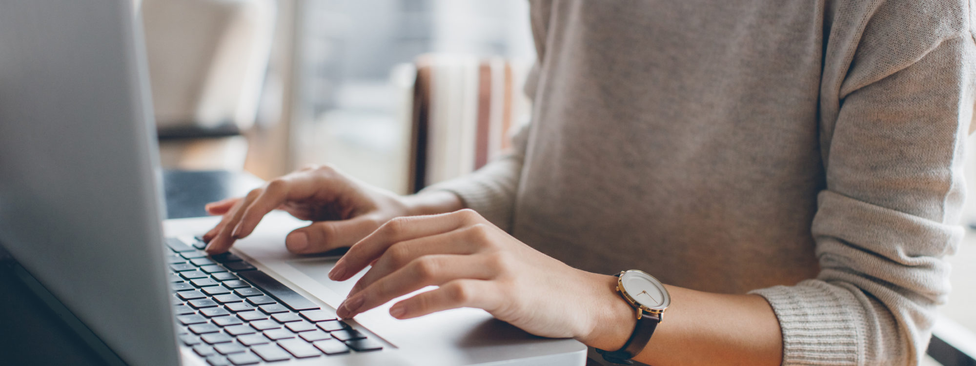 woman using laptop on table
