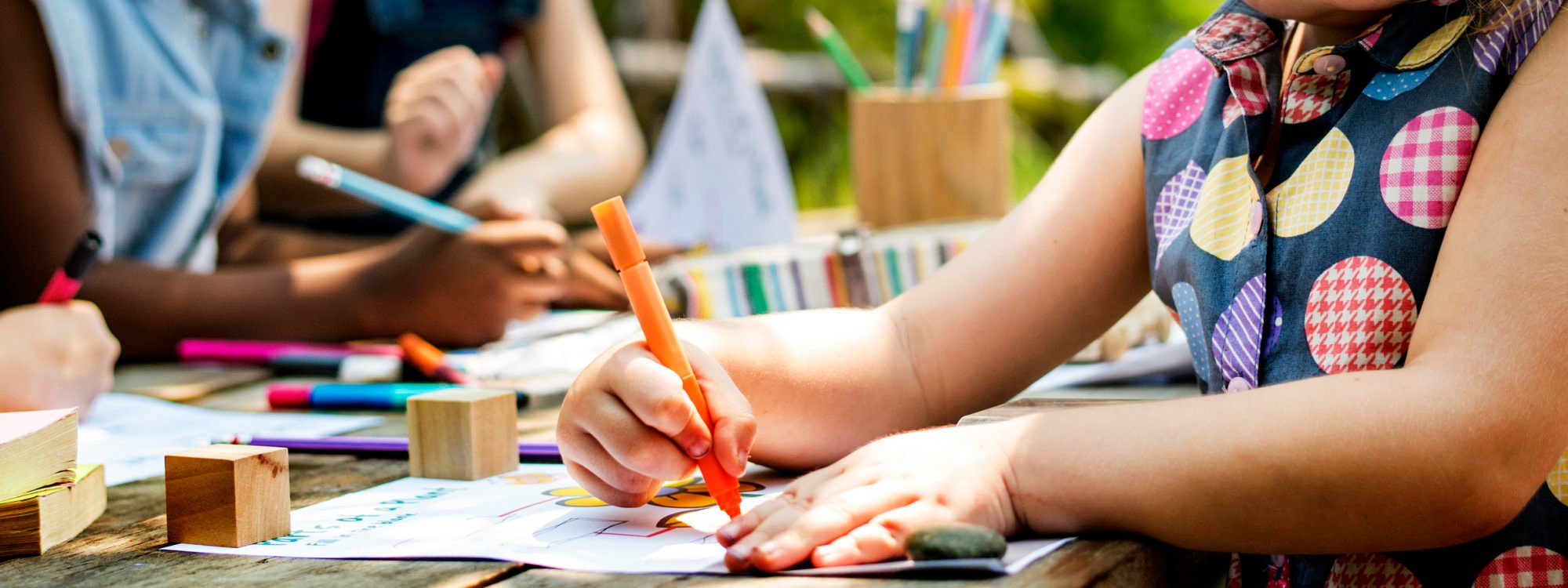 Group of kindergarten kids friends drawing art class outdoors