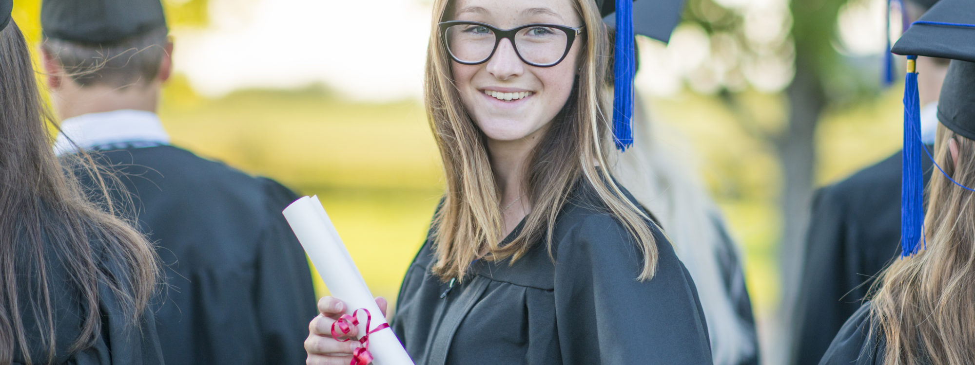 girl holding diploma