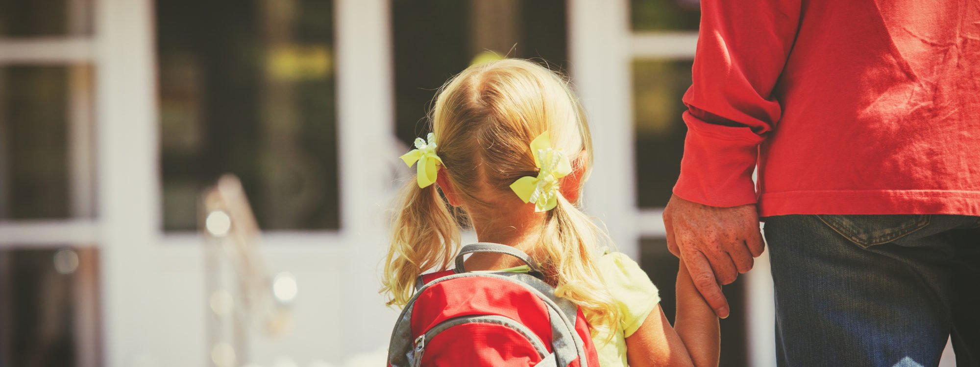 father and little daughter go to school or daycare, education