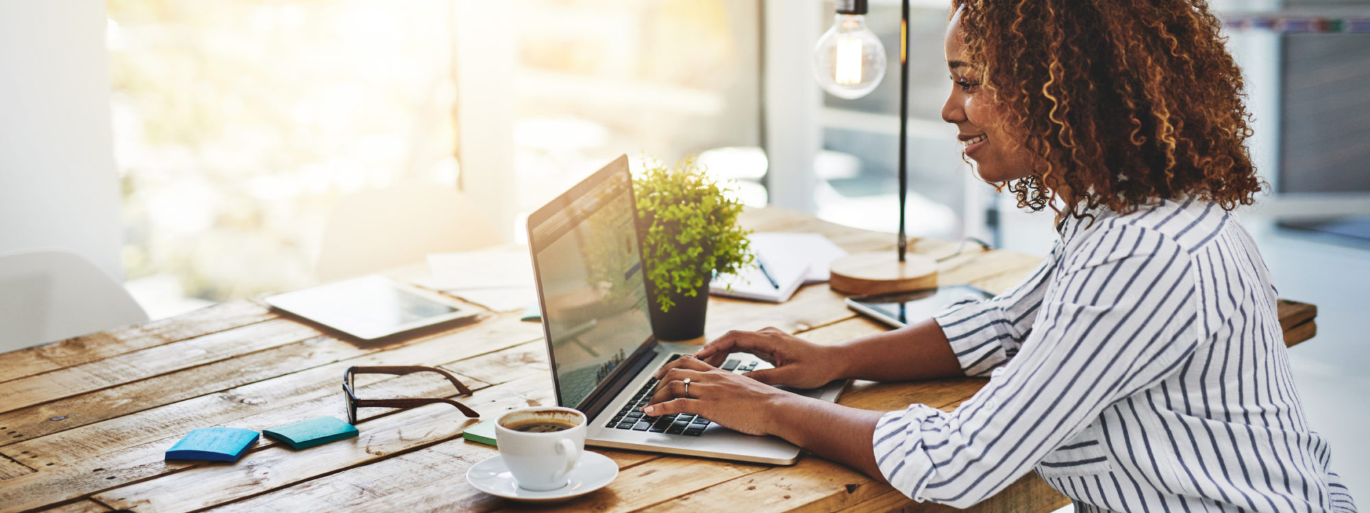 woman using laptop on table