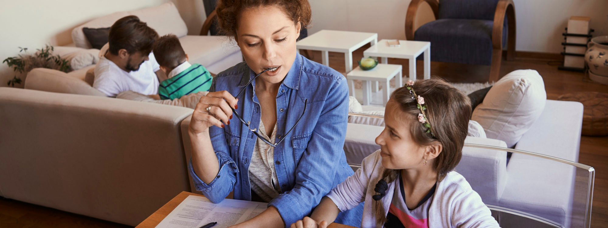 mother using laptop with her daughter