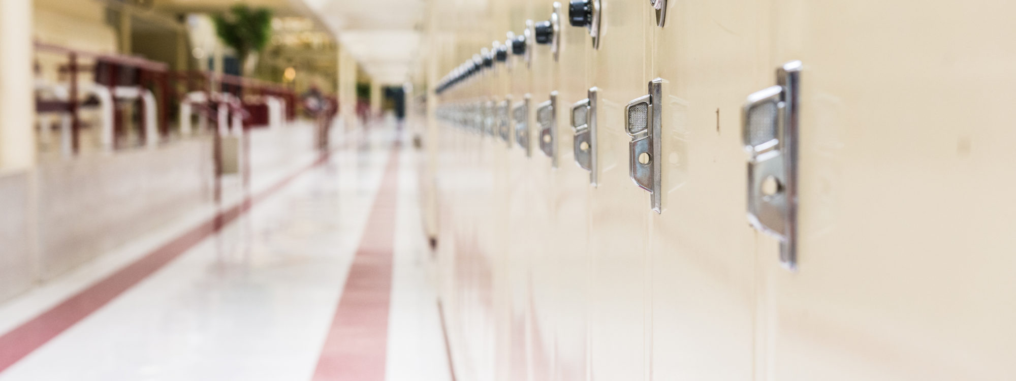 School hallway with rows of lockers