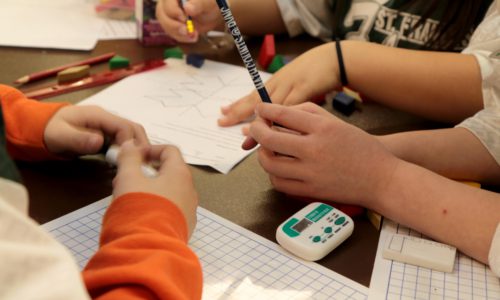 students working at math olympics