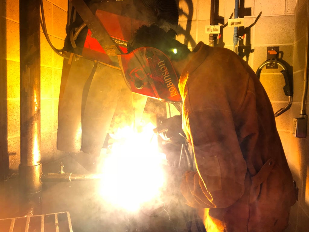 person perfomring welding