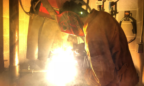 person perfomring welding