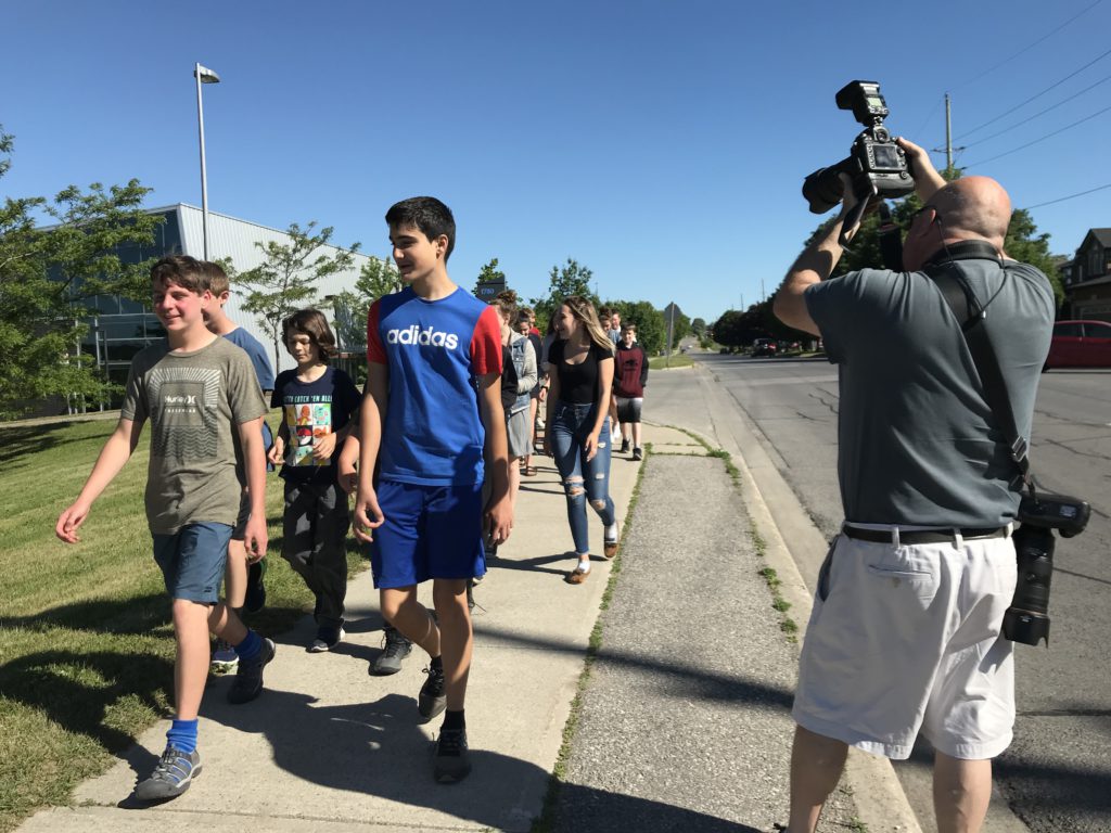 students walking on sidewalk