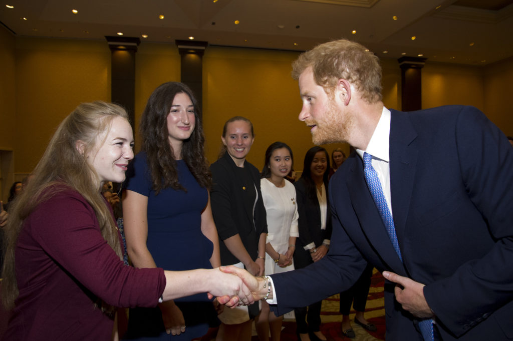man shaking hand with woman