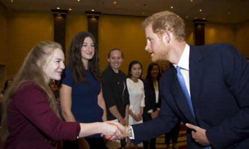 man shaking hand with woman