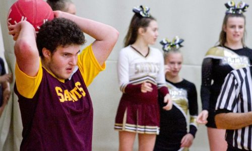 student making Throw In during basketball game