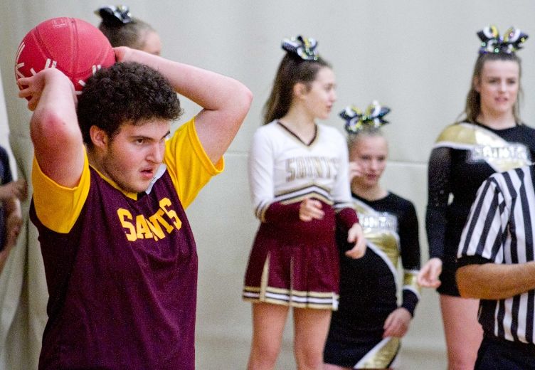 student making Throw In during basketball game