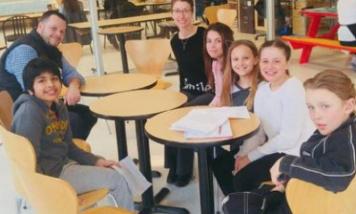 student sitting at tables