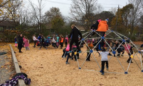 student playing in new playground