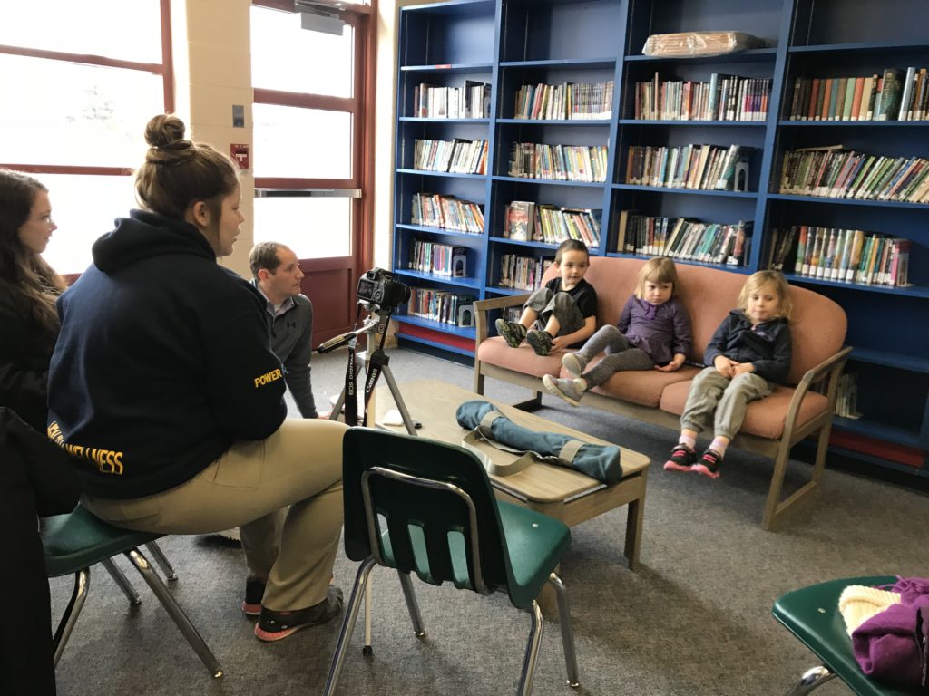 secondary students interviewing elementary students