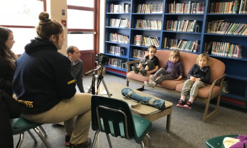 secondary students interviewing elementary students