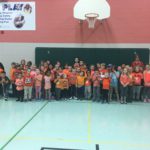 students and staff wearing orange shirts