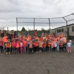 staff and student wearing orange shirts
