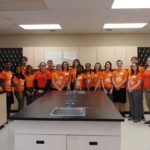 students wearing orange shirts