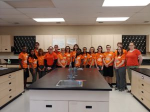 students wearing orange shirts