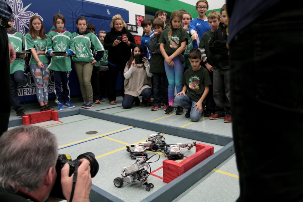 Students competing in robotics battle