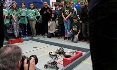 Students competing in robotics battle