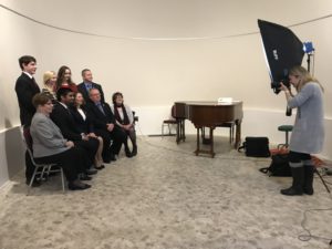 group of people having picture taken by photographer