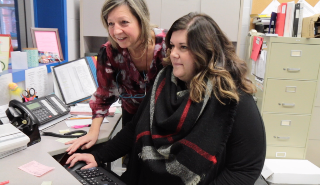two women working at computer