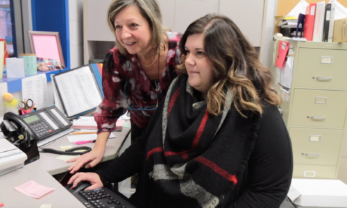 two women working at computer