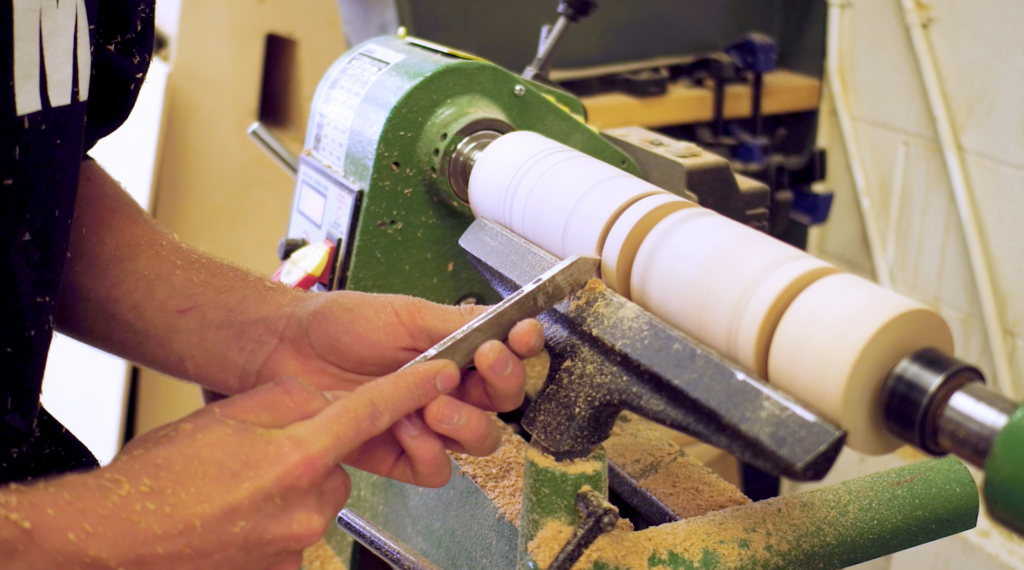 student using a lathe