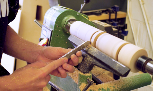 student using a lathe