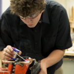 student joining Cooper tubbing