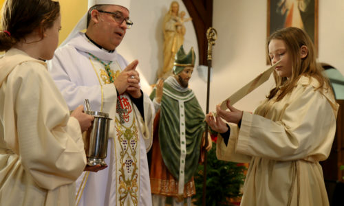 Peterborough Bishop Daniel Miehm blesses a statue of St. Martin of Tours at St. Martin Parish on Thursday, Jan. 17, 2019.
