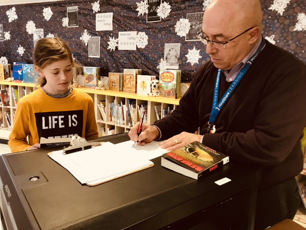 man working with student