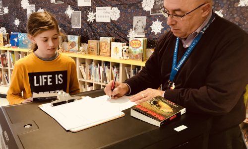 man working with student