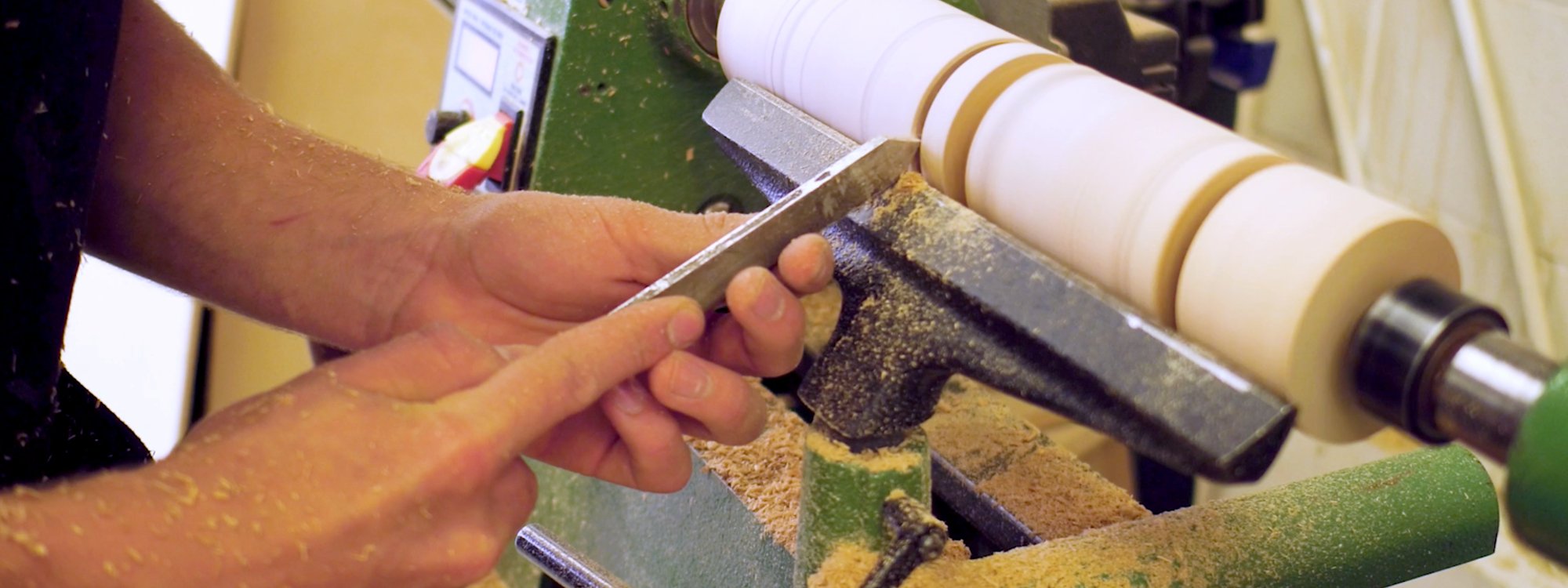 student working with a wood turner