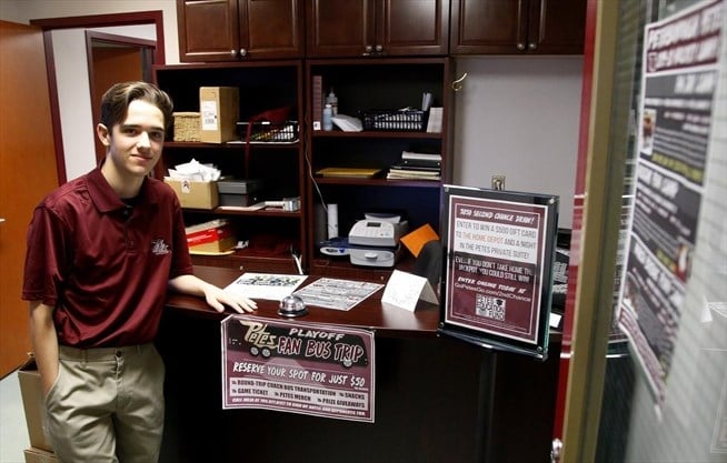 student staying next to work desk