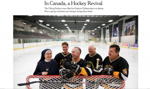 group of people standing in front of a hockey net