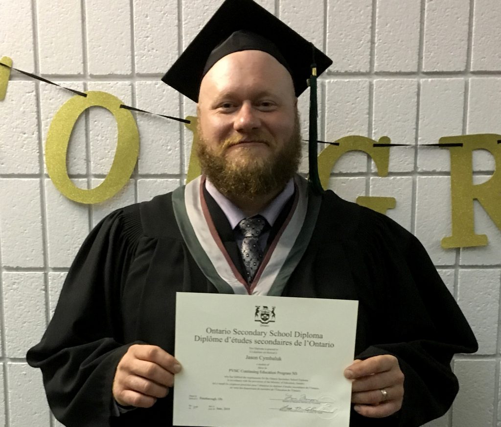 man holding diploma
