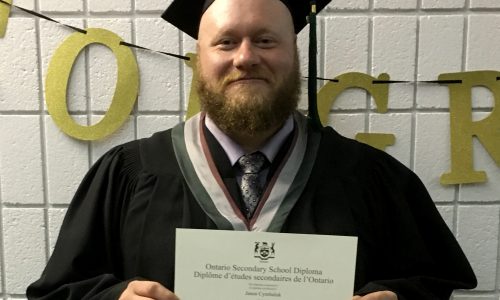 man holding diploma