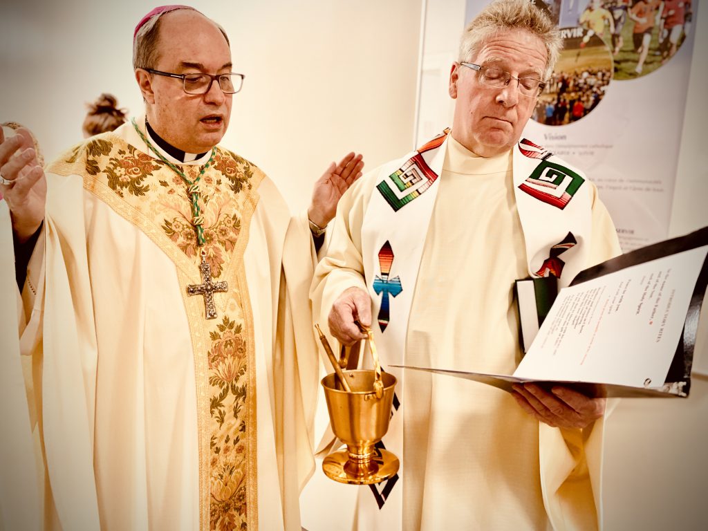 two priests performing mass
