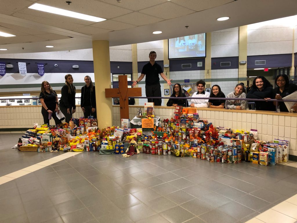 staff and students with food drive collection
