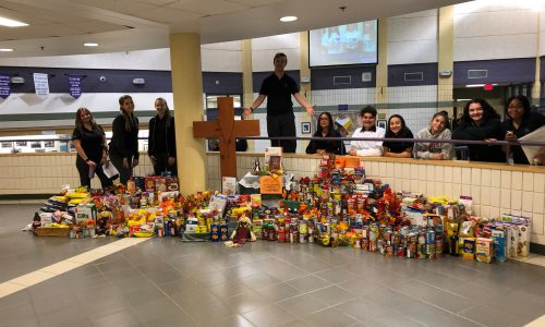 staff and students with food drive collection