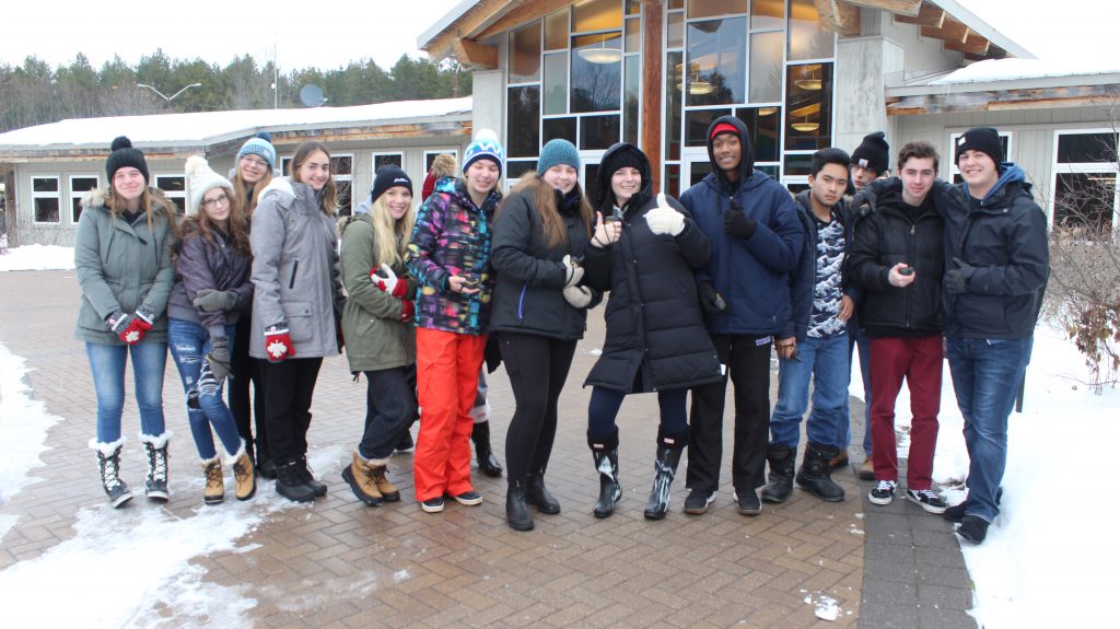 groups of students dressed in winter clothing
