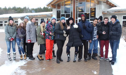 groups of students dressed in winter clothing