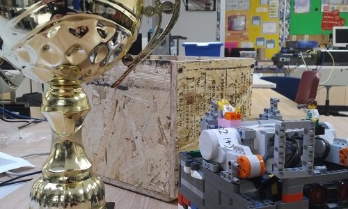 2nd place trophy next to lego robot