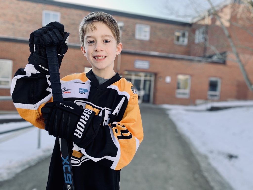 boy in hockey sweater