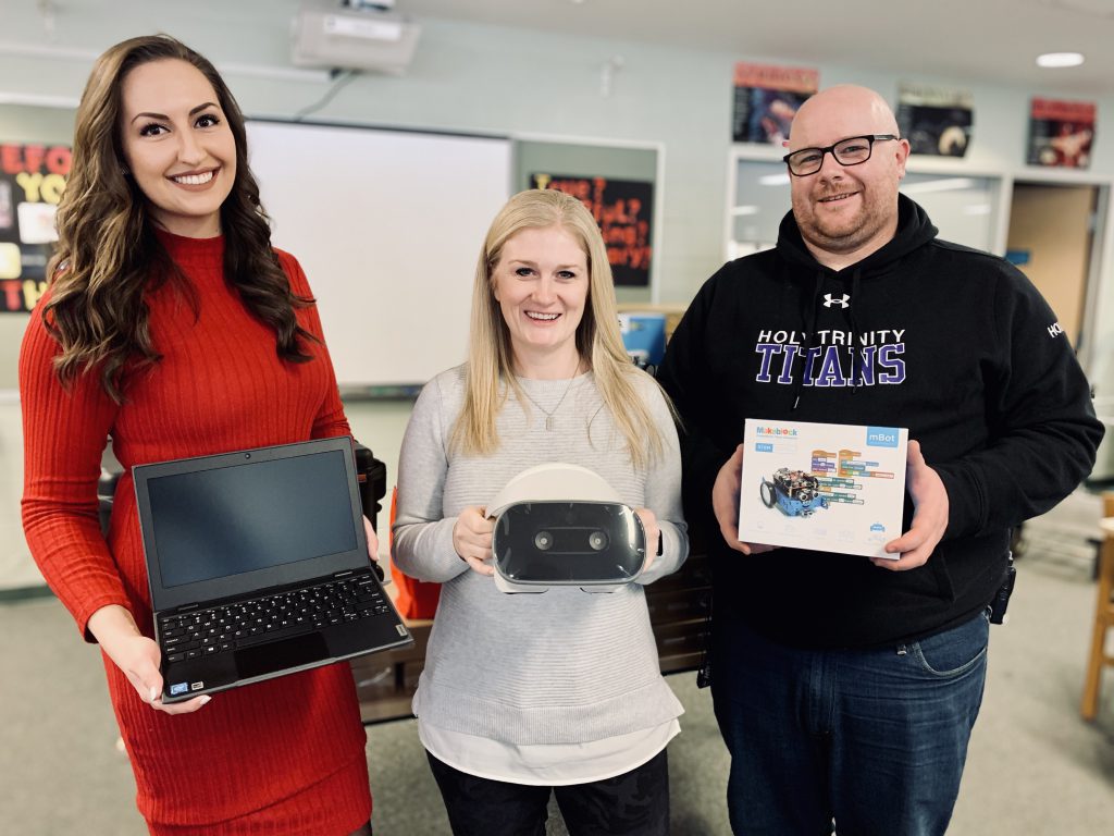 teachers holding various items of school techonology