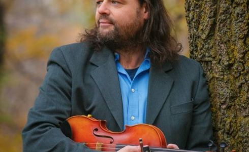 man holding a violin