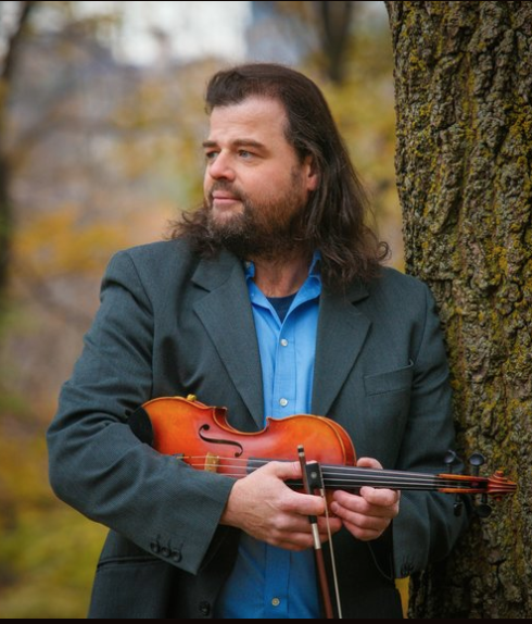 man holding a violin